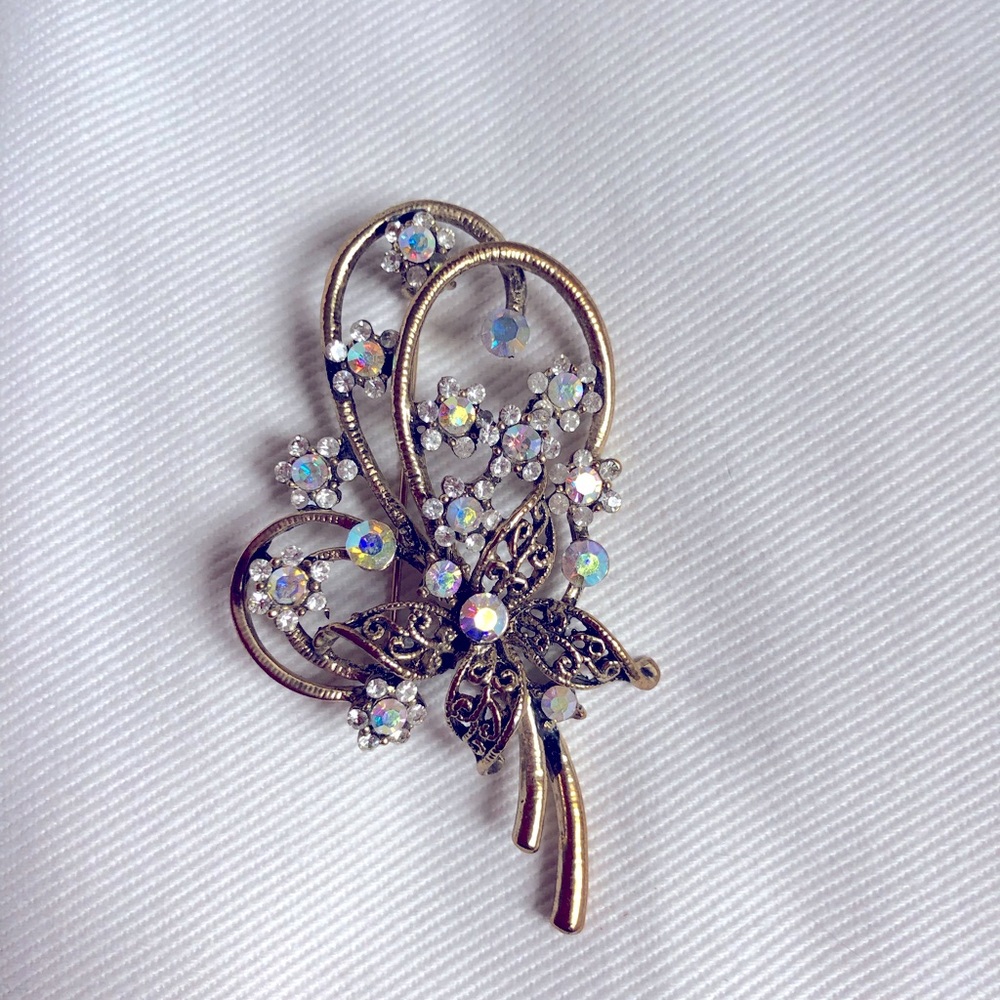 A B rhinestone brooch
